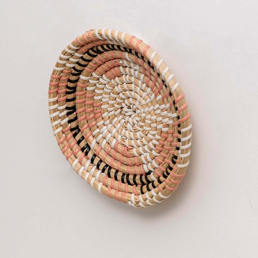 Side view of handwoven wicker basket wall decor showing depth and woven texture for modern boho home decoration.