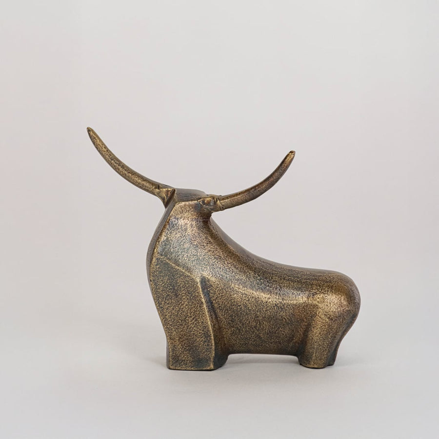 Modern bronze bull sculpture with long horns and textured finish ideal for tabletop accents or office shelf decor