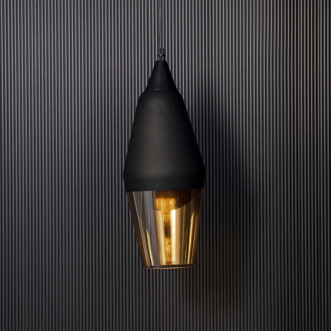 Glowing pendant lamp with matte black top and golden glass shade elegant modern ceiling light for luxury dining and bedroom spaces.
