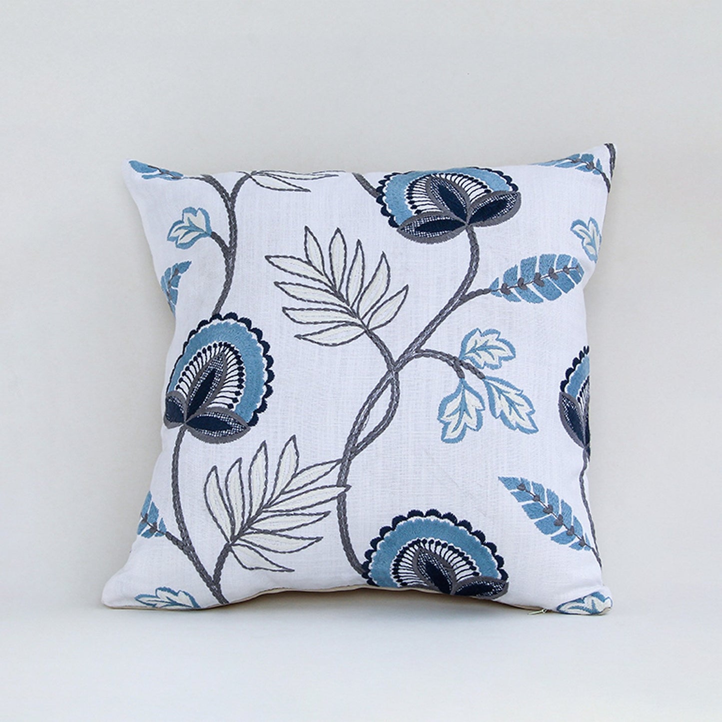 White cotton cushion cover with blue floral botanical print for sofa couch bedroom and elegant home decor styling.