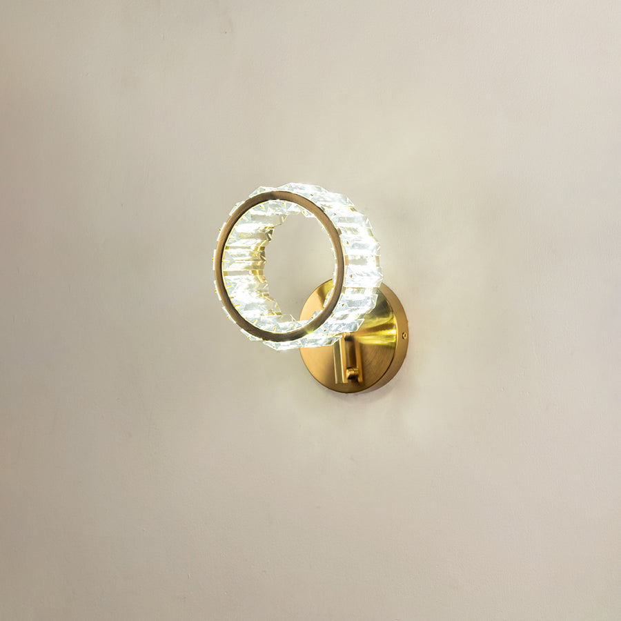 Elegant gold metal wall light with crystal ring shade for luxury bedroom hallway and modern decor styling.