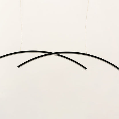 A black curved ceiling light formed by two intersecting arcs ideal for minimal LED lighting and modern designer décor suited for contemporary interiors.