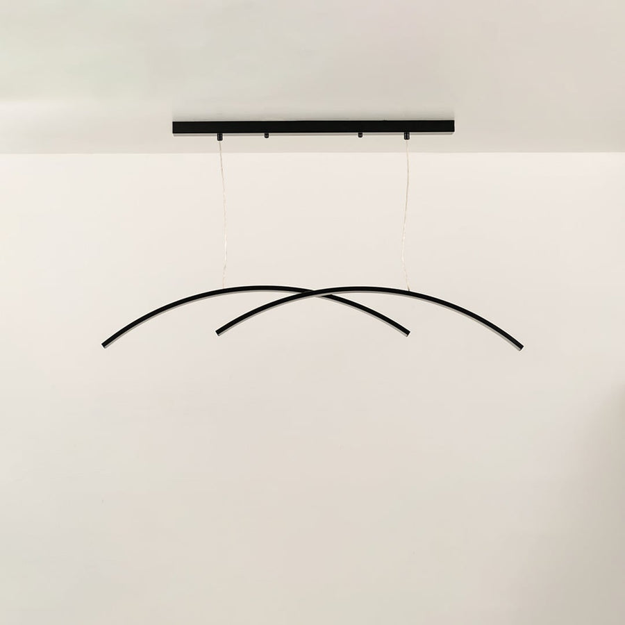 A black curved ceiling light featuring intersecting arcs perfect for modern LED suspension lighting and clean minimal interior décor styling.