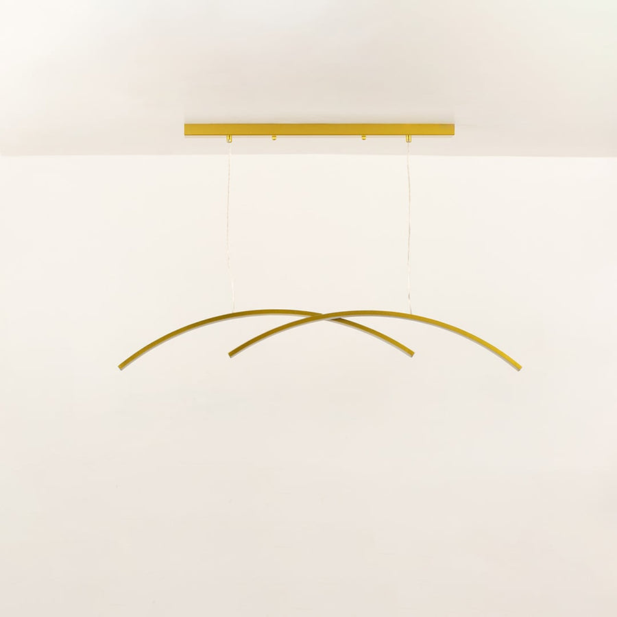A gold curved ceiling light with intersecting arcs ideal for modern LED chandelier lighting and minimal artistic interior décor in contemporary home settings.