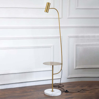 Gold floor lamp with side table and marble base photographed on white background with light turned on for product display.