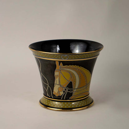 White background image decorative black ceramic vase with golden horse artwork glossy finish luxury home decor accent.