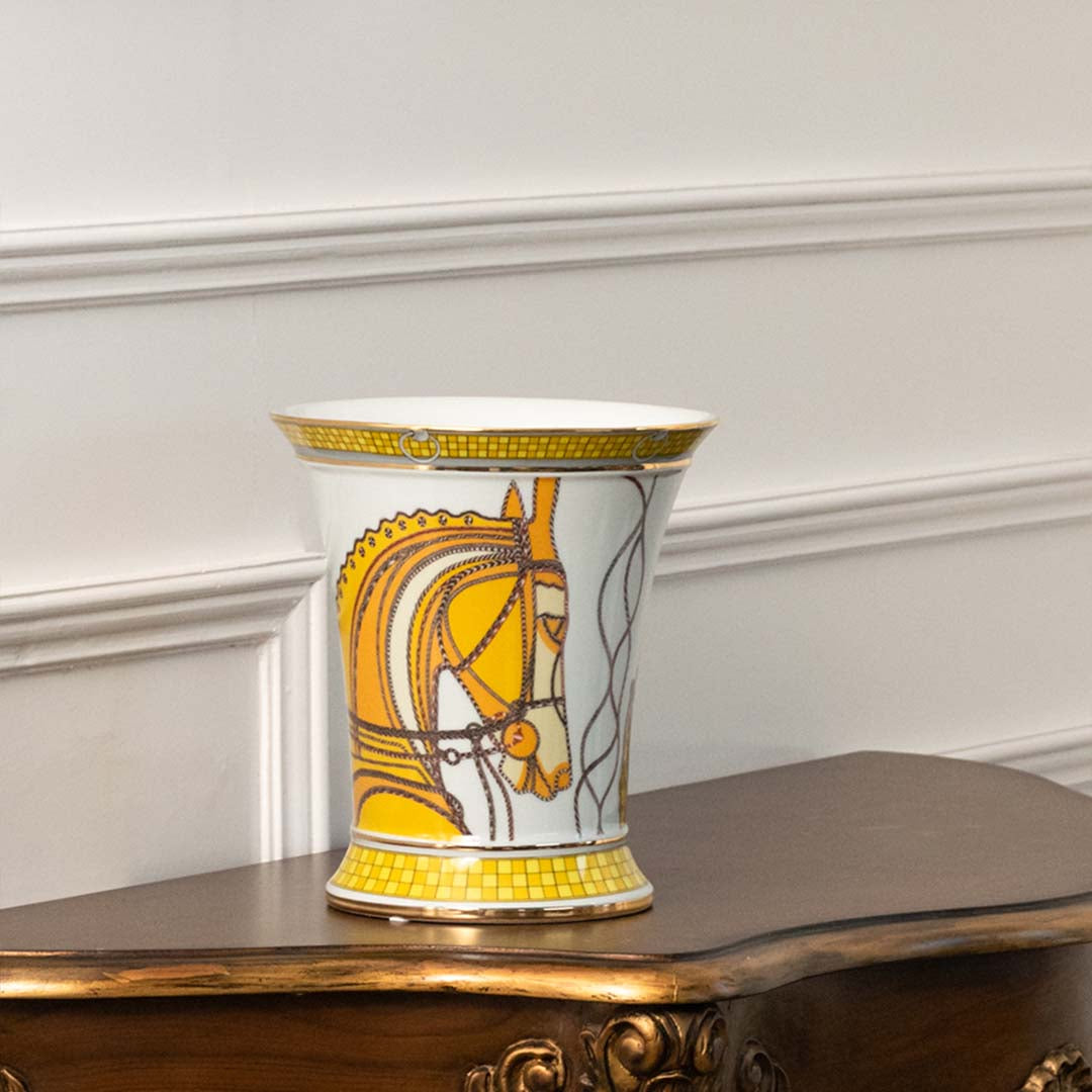 White ceramic decorative jar with gold abstract artwork displayed on a console table for luxury home decor styling.