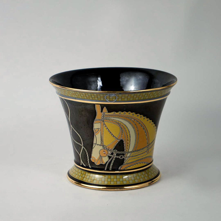 White background image black ceramic vase with intricate golden horse detailing perfect centerpiece for modern interiors.