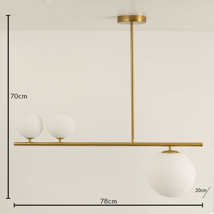 Gold metal chandelier with frosted glass globe shades measuring 70 cm height and 78 cm width for modern interiors.