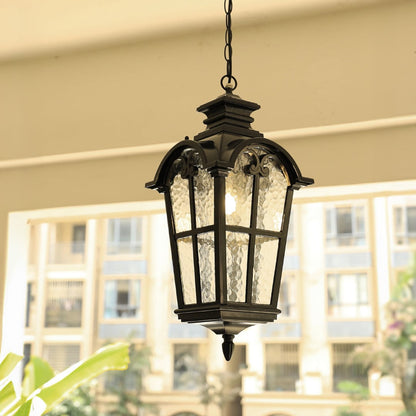 Classic black metal and glass hanging lantern lighting exterior balcony space with elegant traditional charm shown Light off black BG.