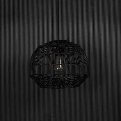 Elegant black rattan pendant light against black background highlighting the woven structure and natural handcrafted finish.