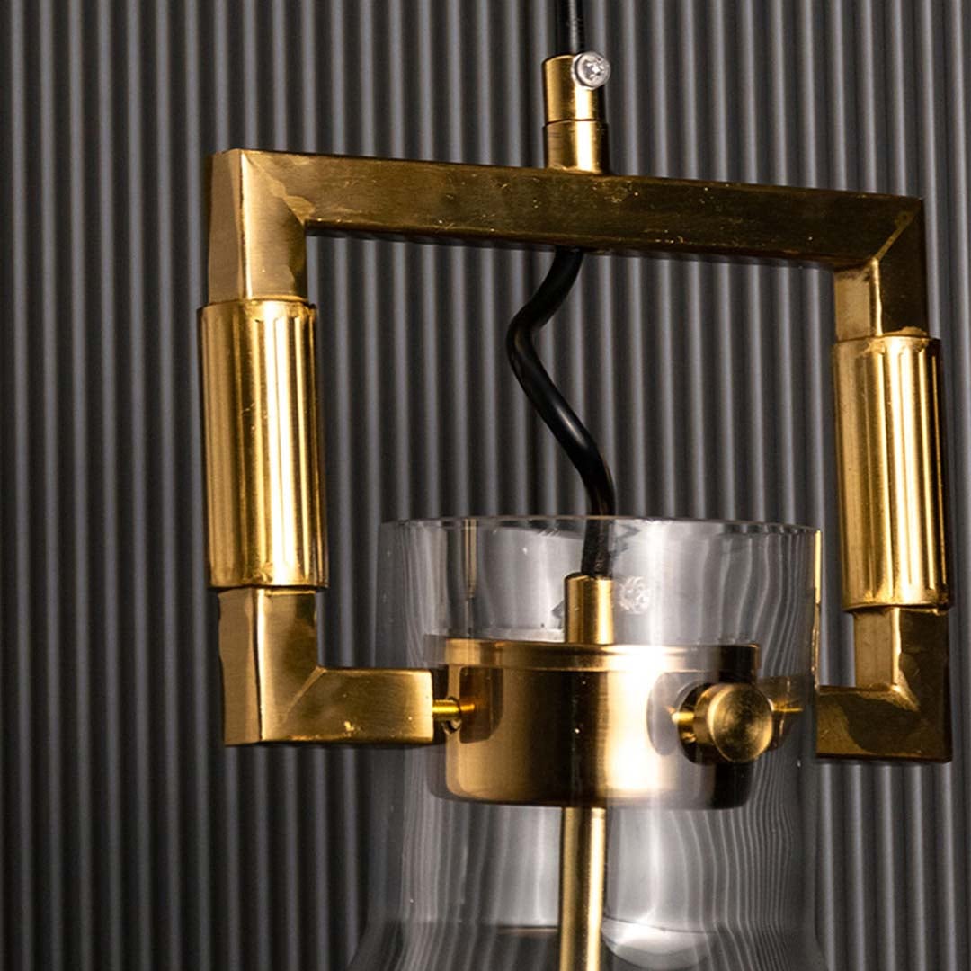 Closeup of lower glass cone shade and bulb holder capturing transparent finish gold accents and clean modern craftsmanship.