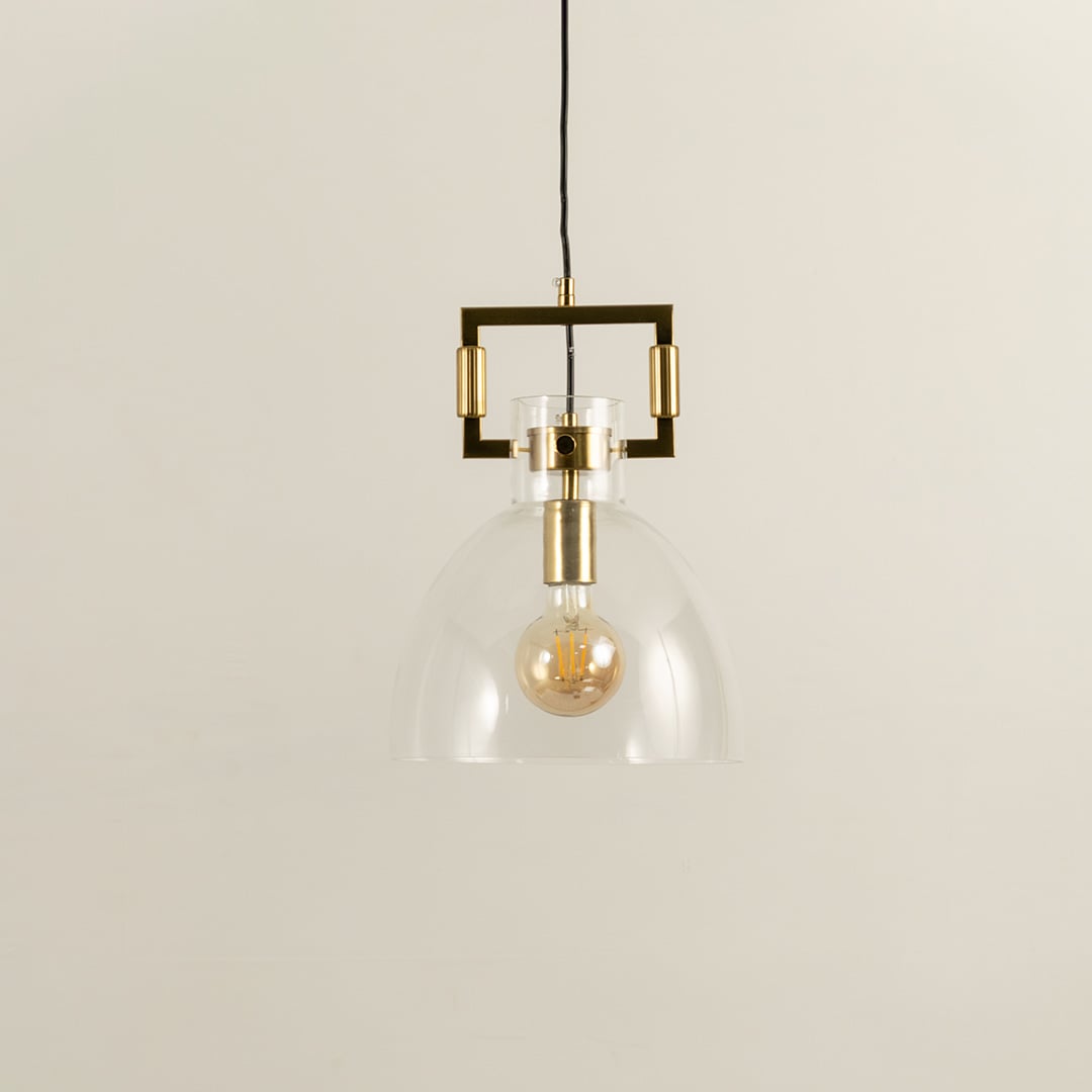 Glass dome pendant light with gold metal accents shown with light off on a white background emphasizing its clean minimalist form.