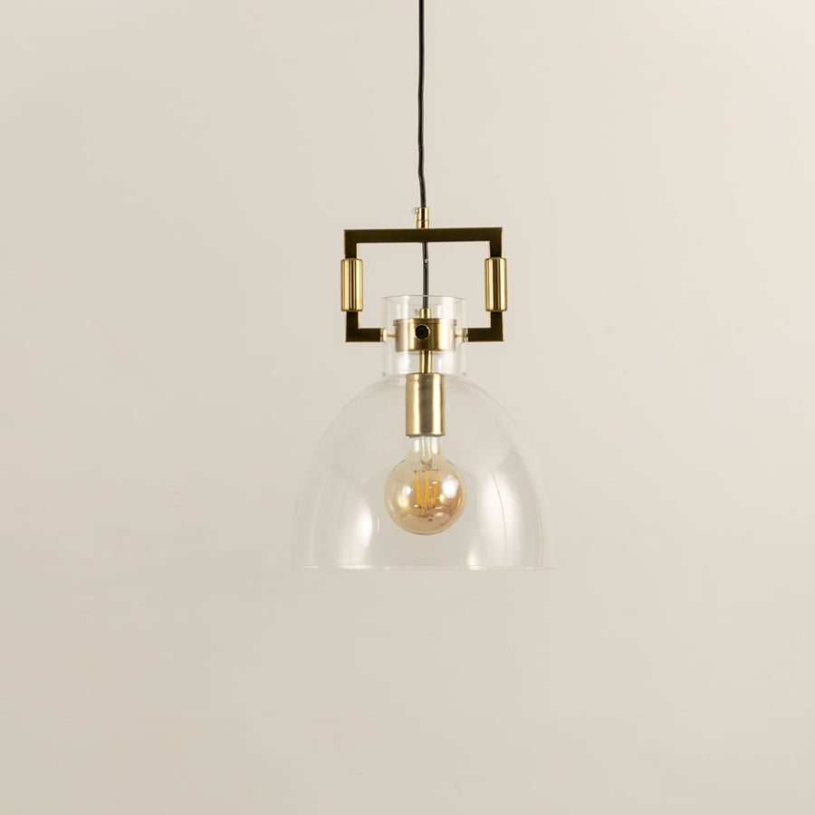 Glass dome pendant light with gold metal accents shown with light off on a white background emphasizing its clean minimalist form.