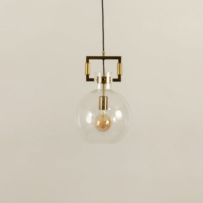 Glass globe pendant light with gold metal detailing shown with light off on a white background emphasizing its sleek minimalist look.