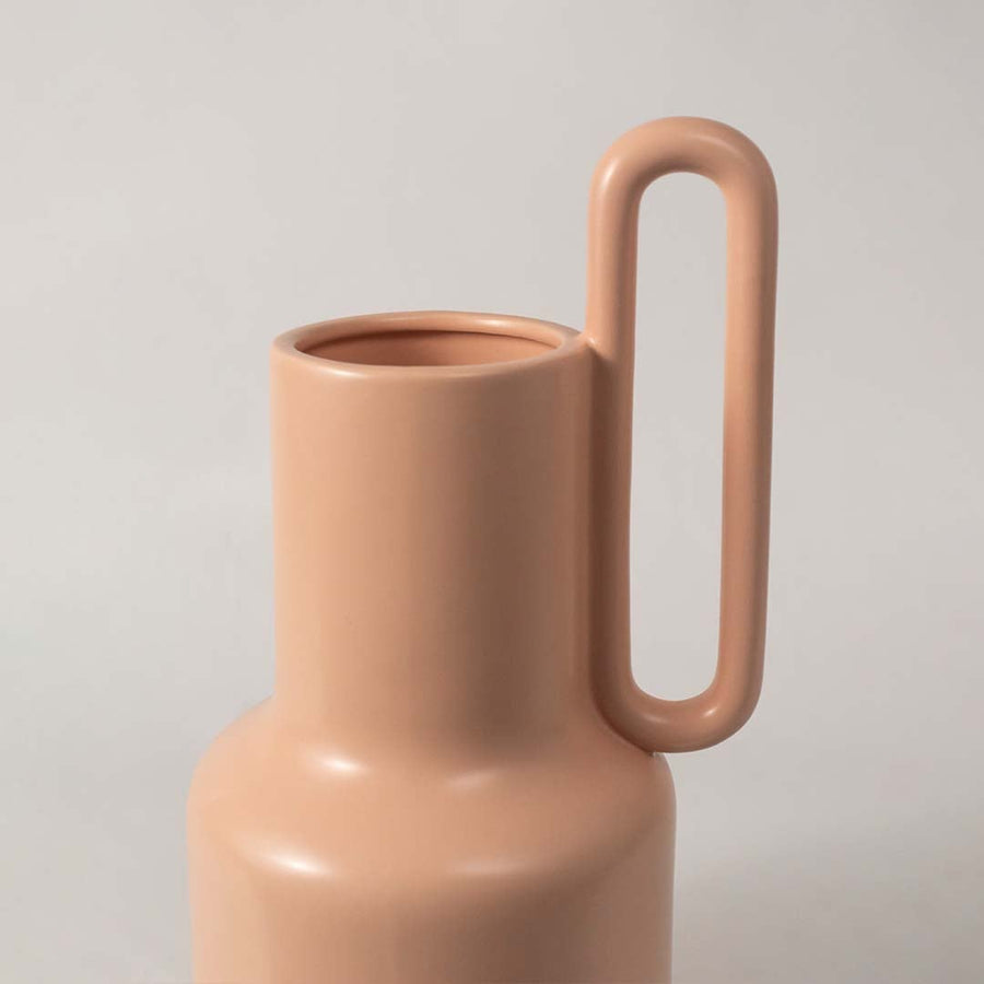 Closeup view of the ribbed white ceramic vase showing its detailed grooves  smooth matte finish  and sculpted neck design.