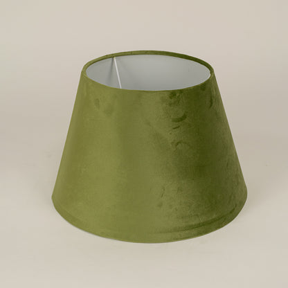 Green fabric lampshade with smooth finish on white background suitable for table lamp bedroom and living room decor.