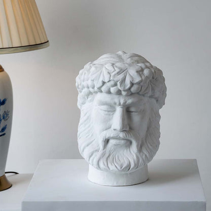 White sculpted head décor piece in a front view ideal for artistic décor styling and modern pedestal display.
