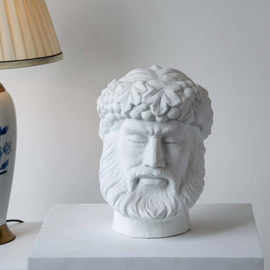 White sculpted head décor piece in a front view ideal for artistic décor styling and modern pedestal display.