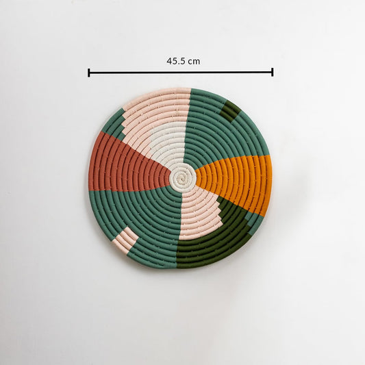 Round woven wall decor in green mustard peach and cream tones on a white background showing its full size clearly marked as 45 point 5 cm diameter.