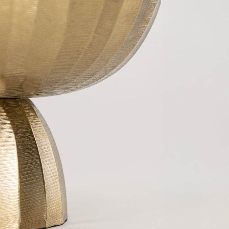 Detailed closeup of the gold textured bowl showing the depth of the finish and the sculpted base against a white backdrop