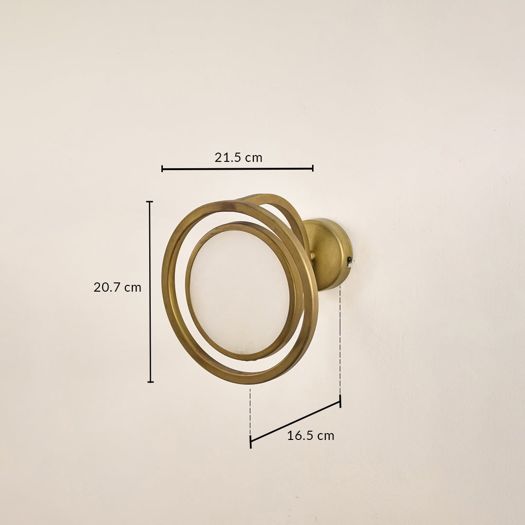 Gold metal ring wall light with 20.7 cm height 21.5 cm width and 10.5 cm depth for modern decor spaces.