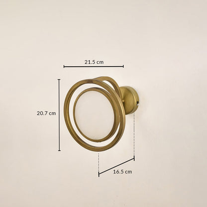 Gold metal ring wall light with 20.7 cm height 21.5 cm width and 10.5 cm depth for modern decor spaces.