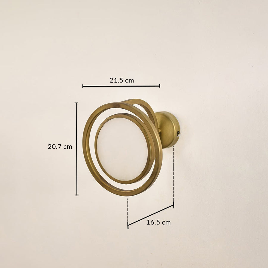 Gold metal ring wall light with 20.7 cm height 21.5 cm width and 10.5 cm depth for modern decor spaces.