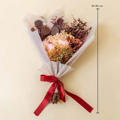 Decorative dried flower bouquet with infinity rose hydrangea billy ball crystal grass limonium grass and eucalyptus leaves.