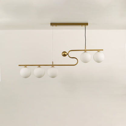 Gold asymmetrical ceiling light with four white globe bulbs in a front view against a plain white background with lights off perfect for modern luxury lighting décor.