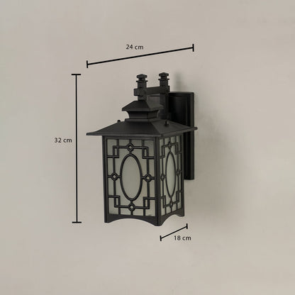 Black metal outdoor lantern with oval patterned frosted glass shown with 32 cm height 24 cm width and 18 cm depth offering accurate exterior installation details.