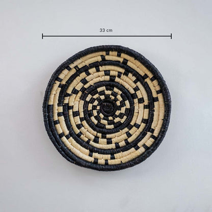 Circular woven wall basket with black border pattern displaying approx 30 cm diameter suitable for accent wall decor styling.