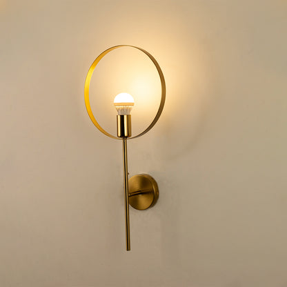 Modern gold ring wall light with warm ambient glow for stylish bedroom and premium decor styling spaces.

