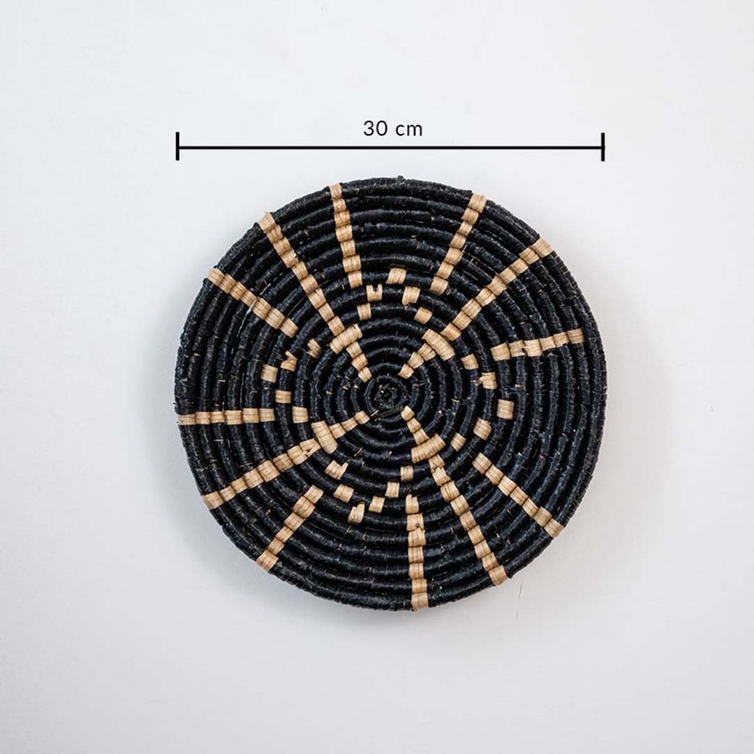 Close-up shot of a 30 cm black and beige woven basket showcasing detailed craftsmanship and design.