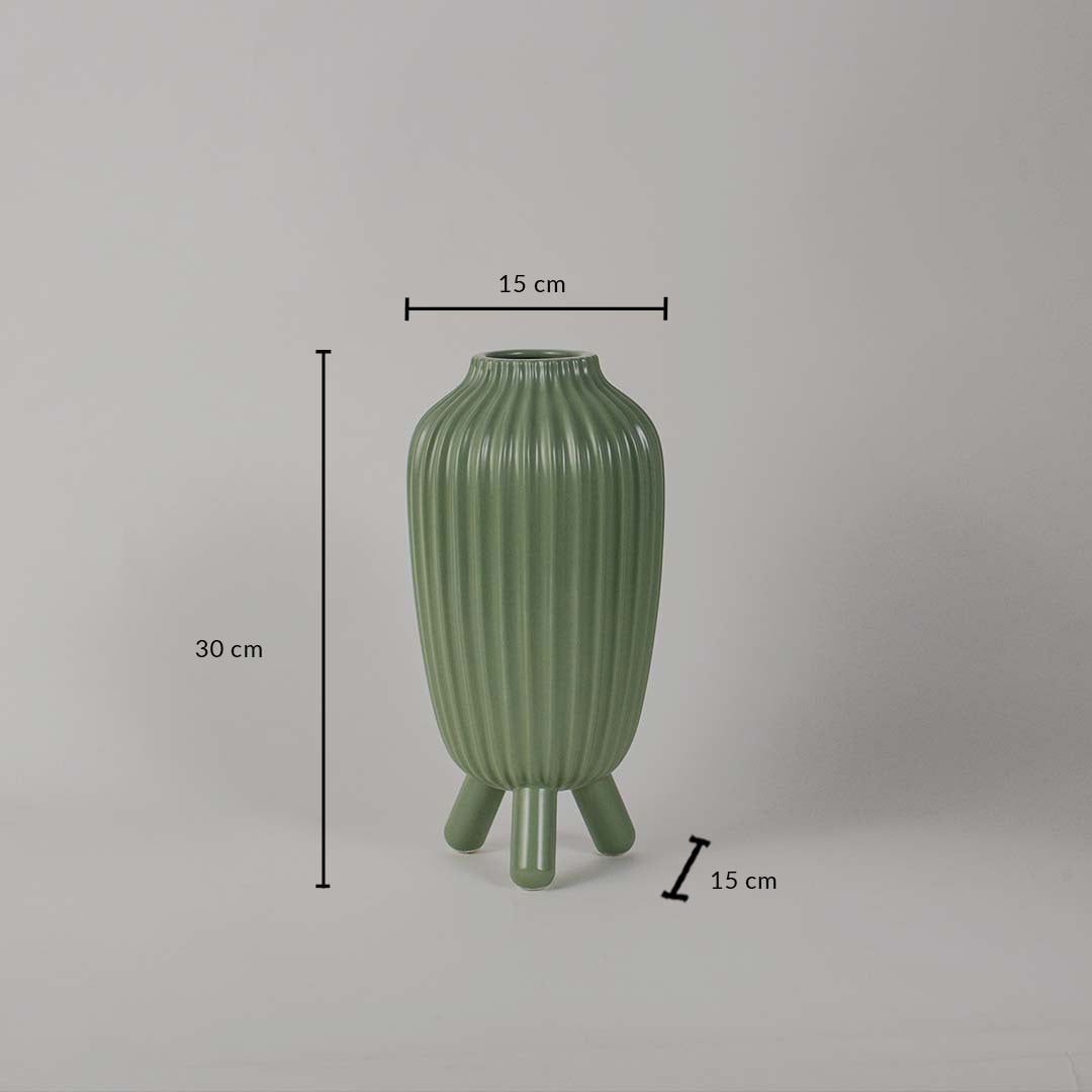 Green ribbed vase displayed with dimensions showing a height of 30 cm a width of 15 cm and a base spread of 15 cm against a clean plain background.
