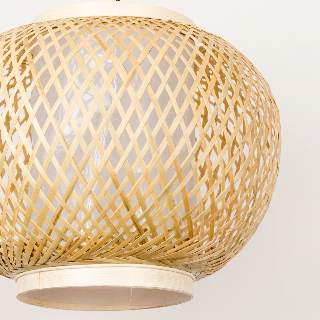 Closeup view of bamboo pendant light showing intricate weaving and natural texture.