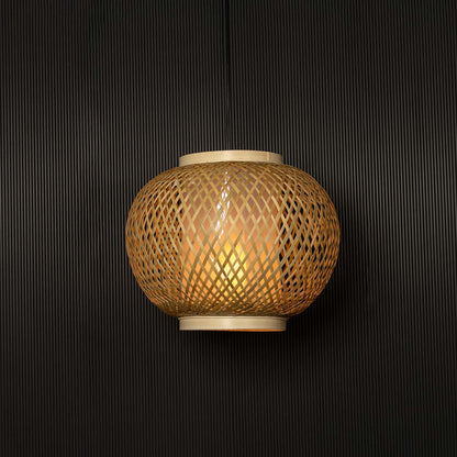 Bamboo pendant lamp illuminated on black background highlighting warm golden glow and detailed craft.