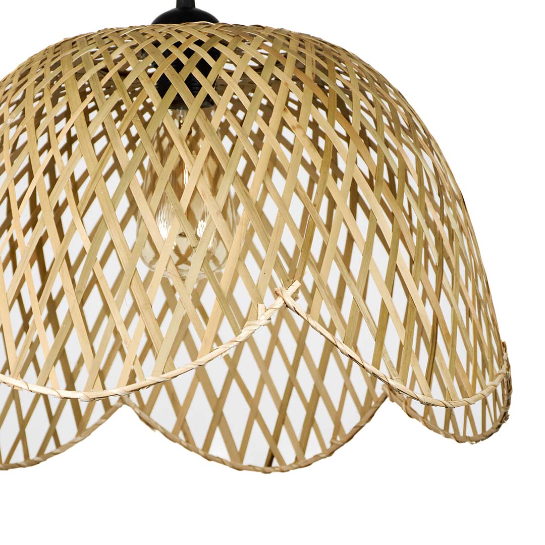 Closeup of scalloped beige rattan pendant light showcasing handcrafted weave and timeless design style.