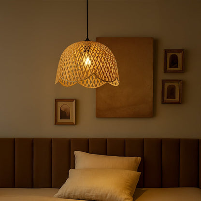 Natural woven rattan pendant light illuminating bedroom with warm boho charm and relaxing ambiance.