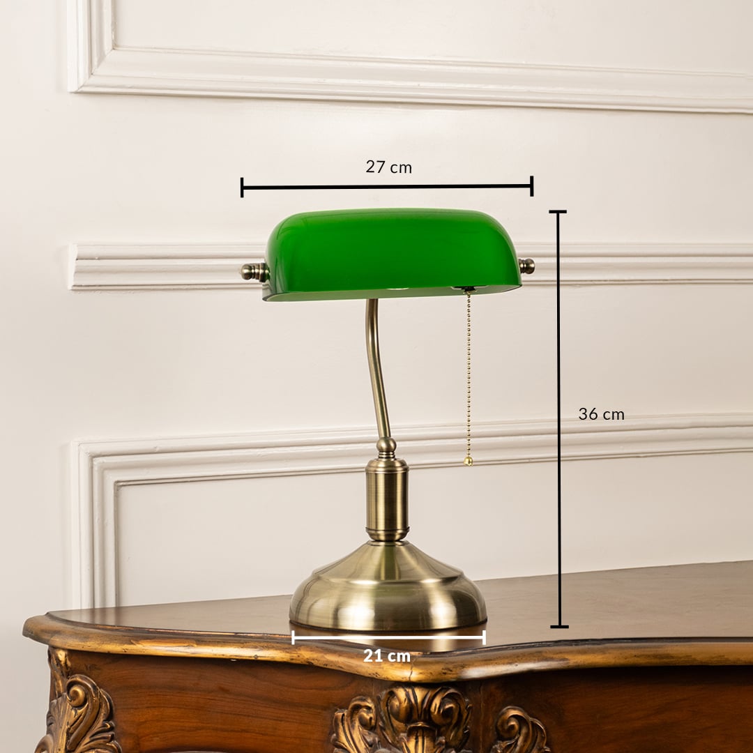 Green glass banker table lamp with antique brass base shown with 36 cm height and 27 cm width measurement detail.