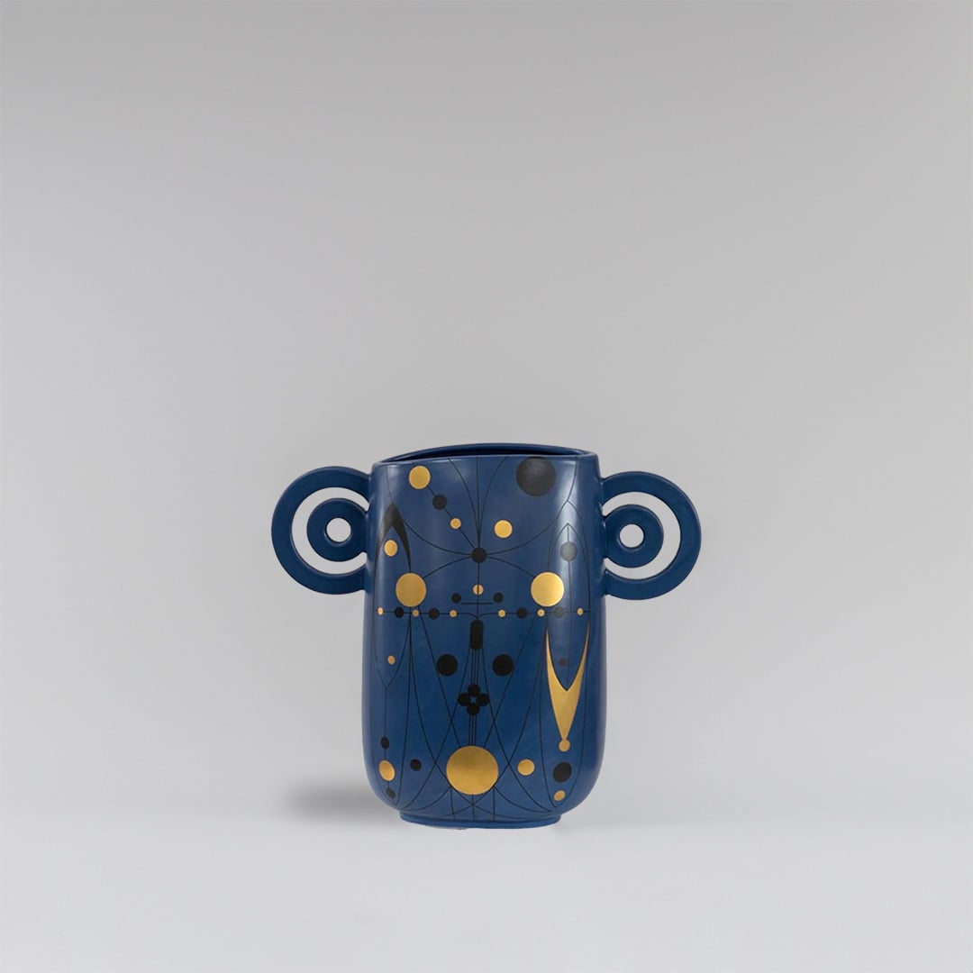 Navy blue ceramic vase with abstract gold detailing and loop handles displayed on a clean white background for modern decor styling.