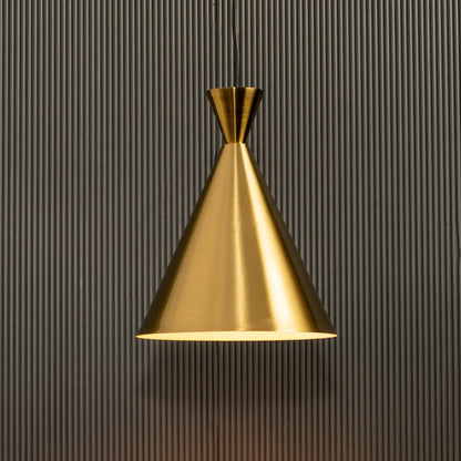 A metal cone pendant light glowing softly against a ribbed dark background providing focused warm lighting and refined minimalist contemporary décor.