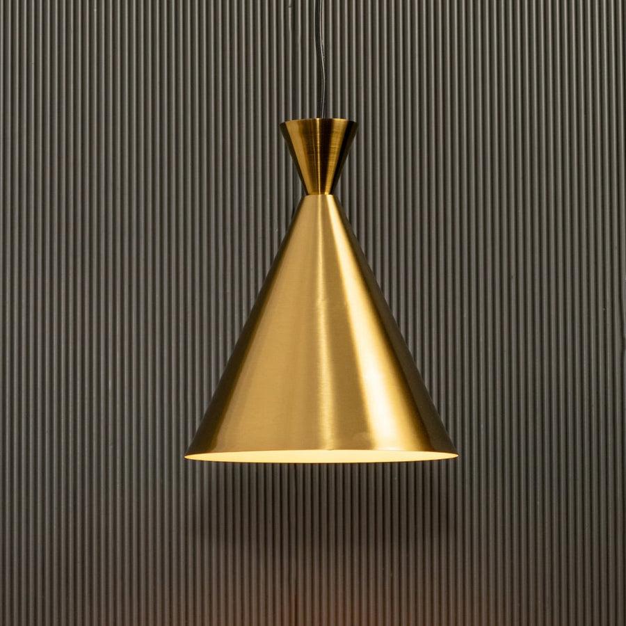 A metal cone pendant light glowing softly against a ribbed dark background providing focused warm lighting and refined minimalist contemporary décor.