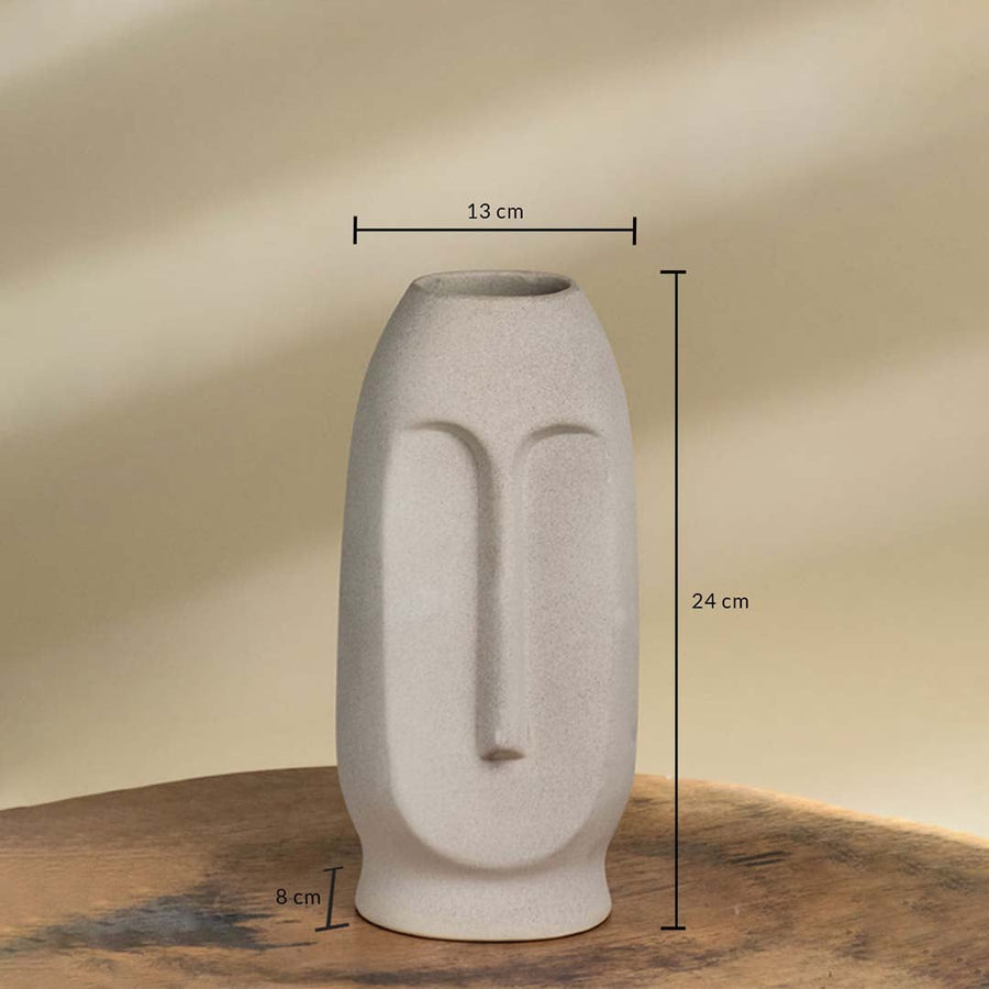 Beige ceramic face vase with sculpted modern design shown with dimensions of 13 cm width 24 cm height and 8 cm base ideal for consoles shelves or tabletops.