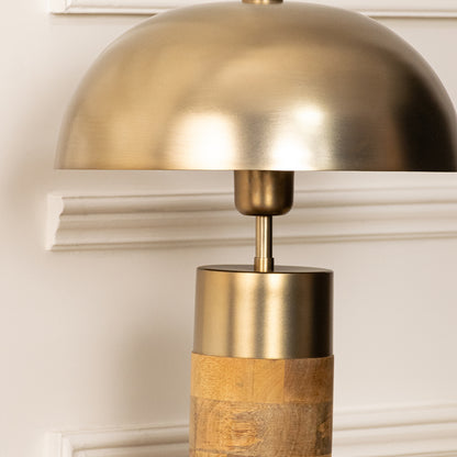 Closeup of brushed gold metal table lamp shade for elegant bedroom and living room decor styling inspiration.