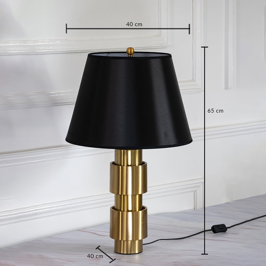 Gold base table lamp with black shade shown with 65 cm height and 40 cm width for home decor placement.