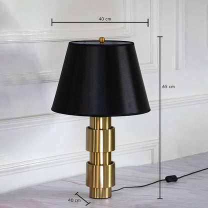Gold base table lamp with black shade shown with 65 cm height and 40 cm width for home decor placement.