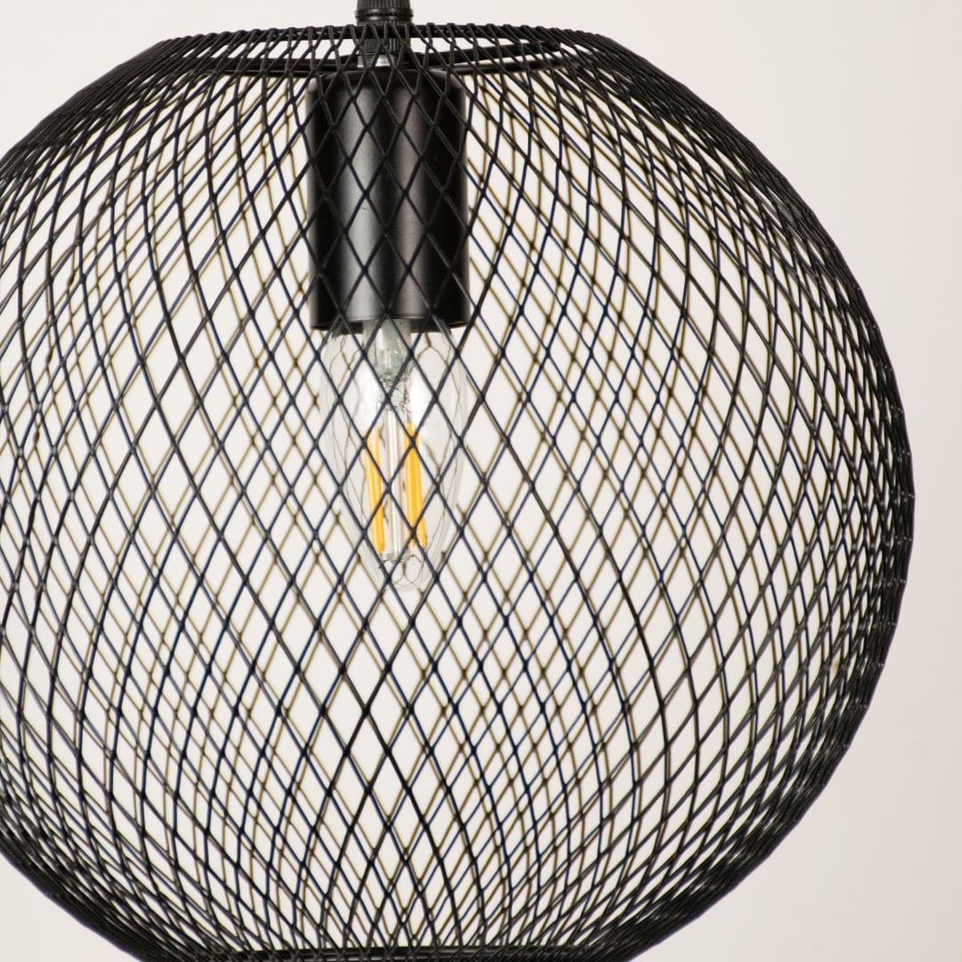Close view of black mesh pendant light showing detailed craftsmanship smooth metal finish and fine industrial design elegance.