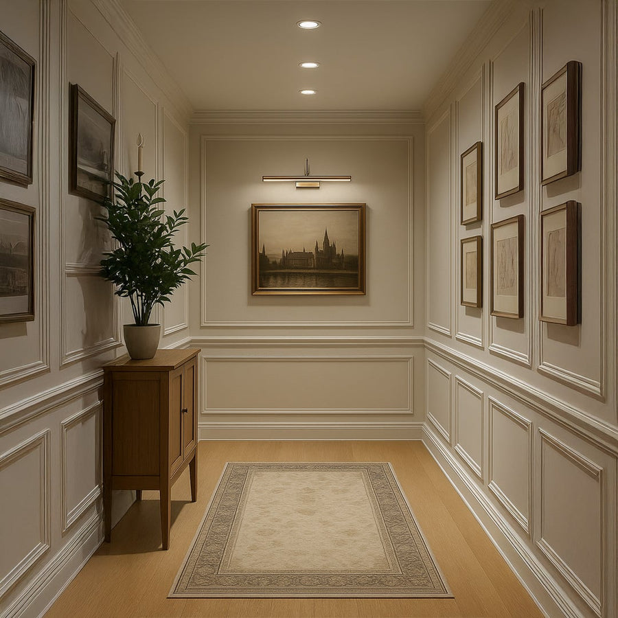 Gold adjustable picture light styled in a modern living room highlighting artwork with warm illumination for elegant wall decor.