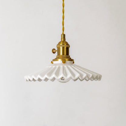 White ceramic and gold metal pendant light showcasing artistic craftsmanship for modern spaces.
